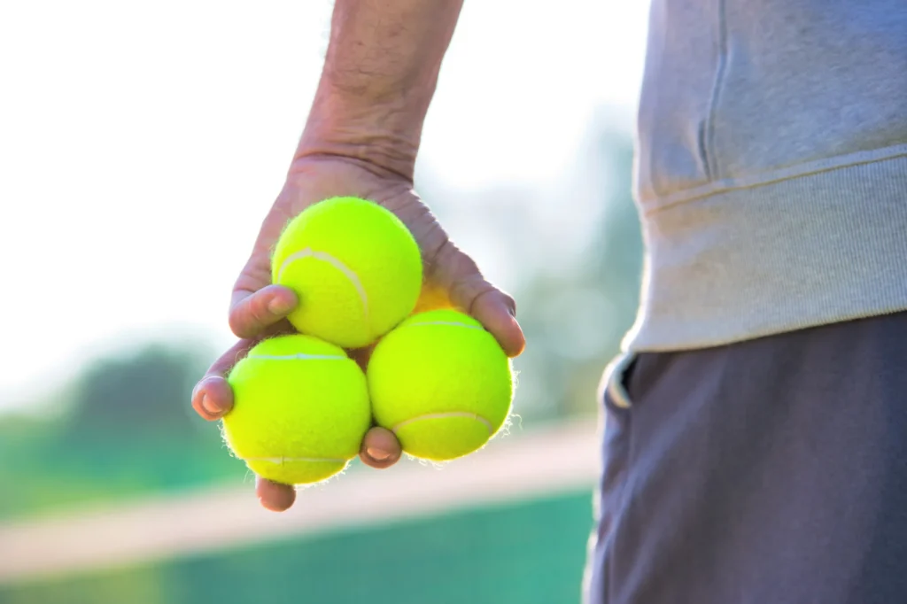 Man holding tennis balls
