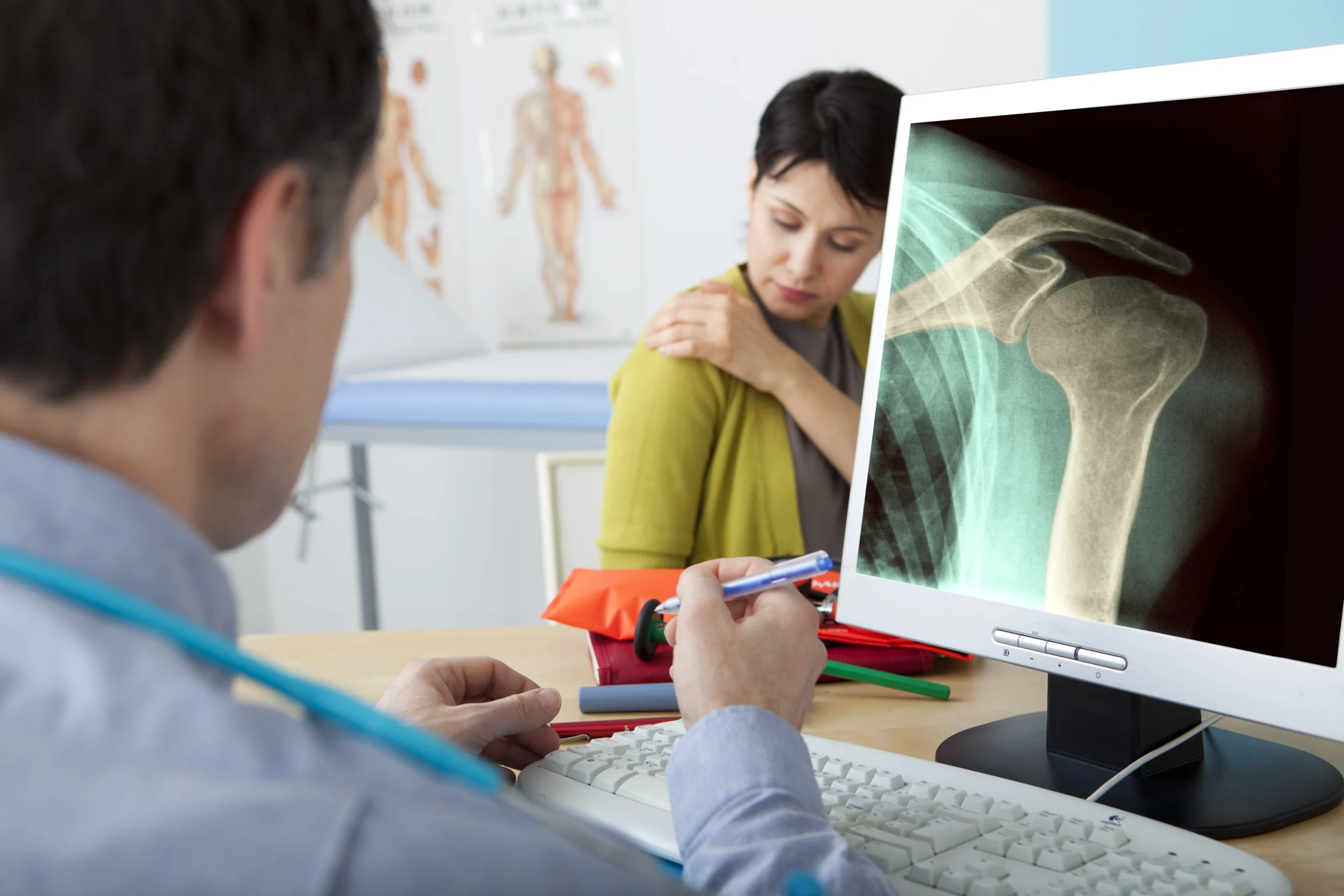 patient considering shoulder surgery with doctor